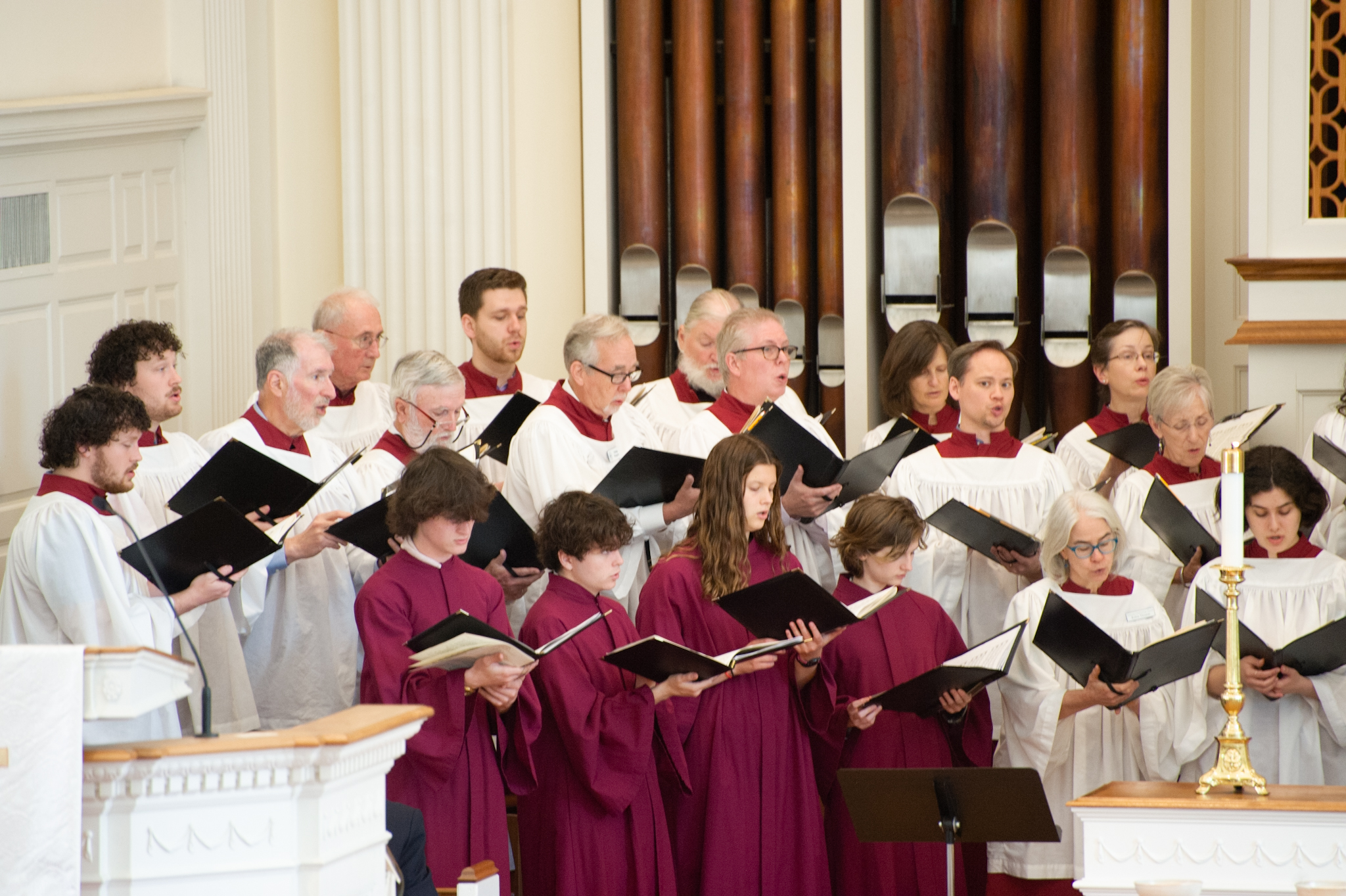 Adults and youth singing together in worship