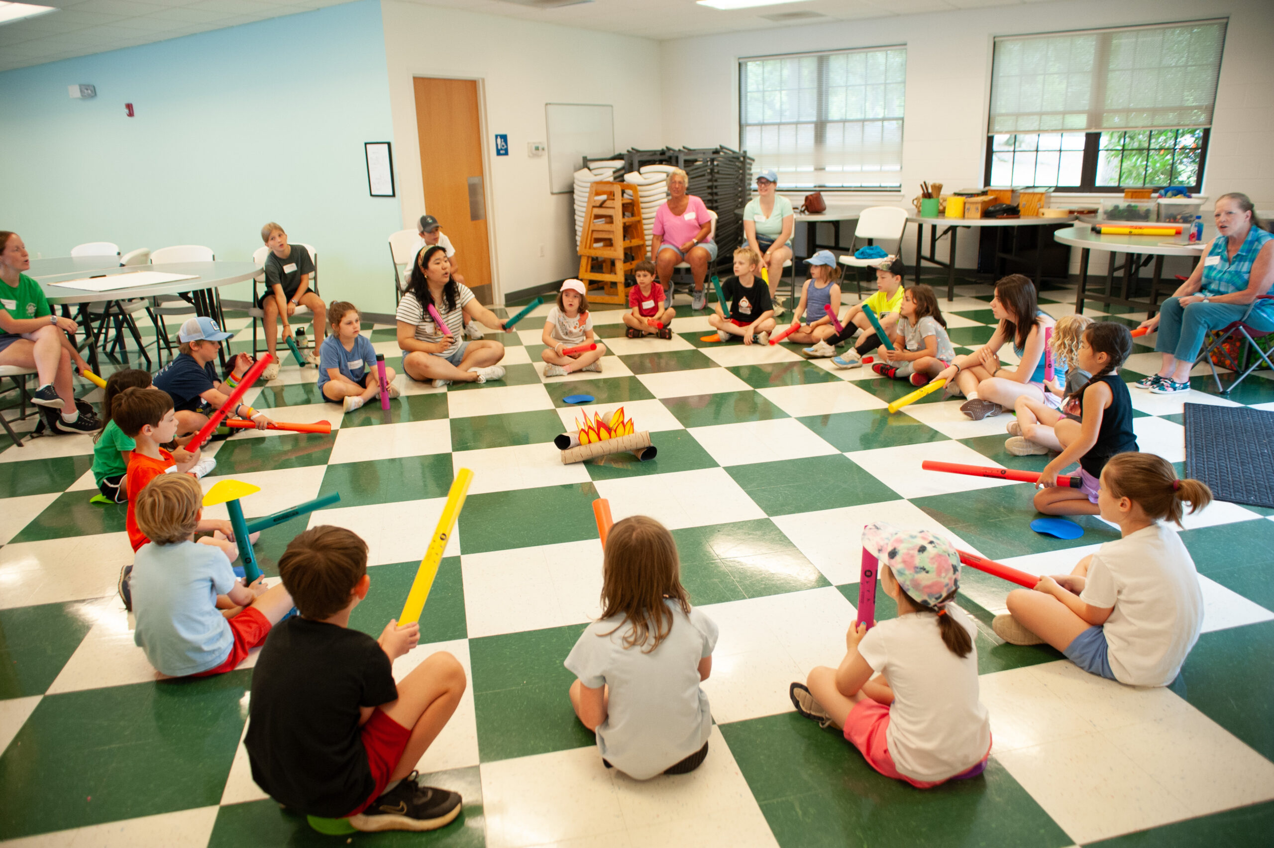 Children singing together in a classroom