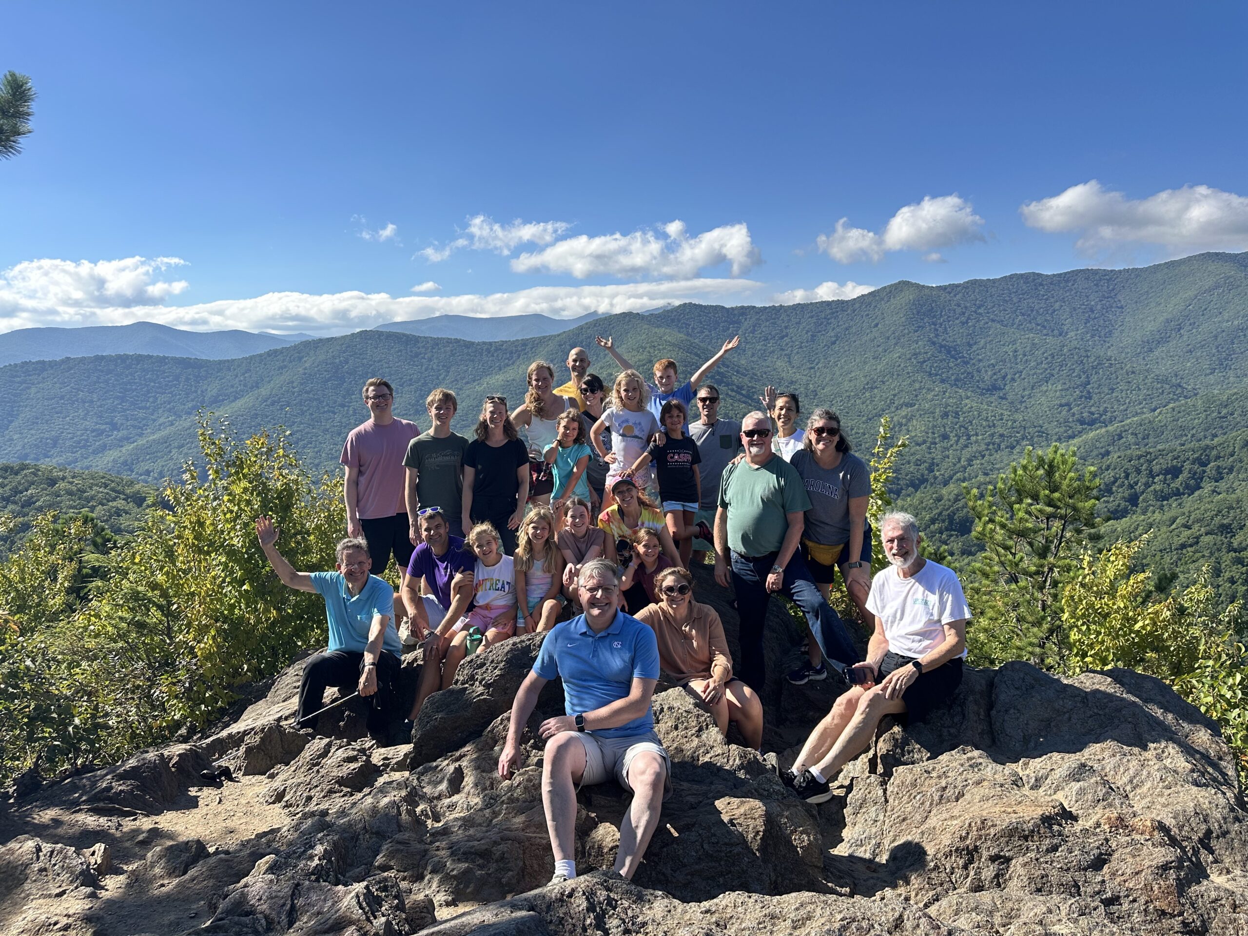 a group sitting on a bench eating ice cream in Black Mountain